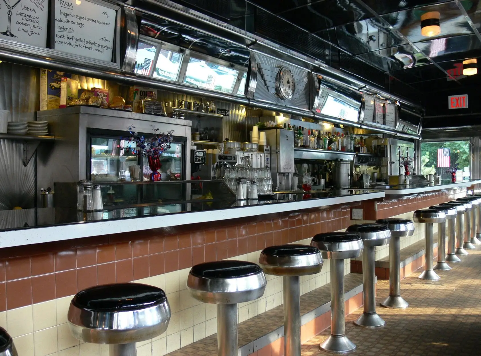 A bar with stools and a counter in it